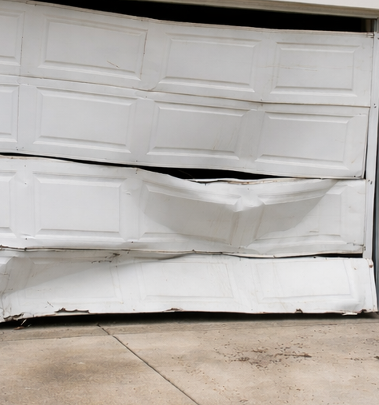 Garage door repair technician servicing a residential garage door in Evansville IN
